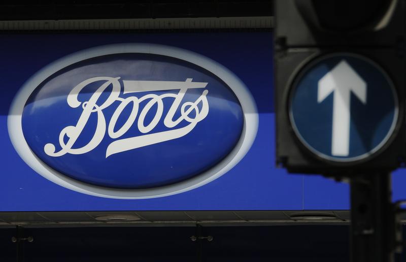 A sign outside a store of pharmacy and cosmetics chain Boots is seen in London, May 16, 2011.