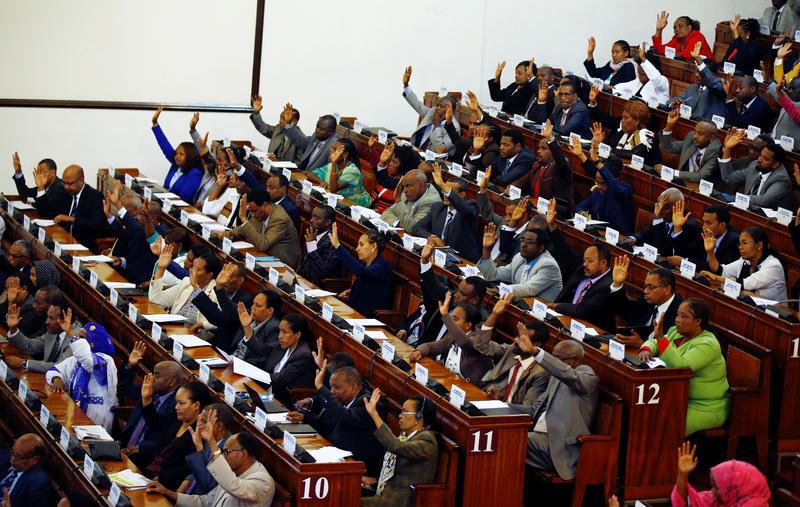 Ethiopian Members of Parliament raise their hands in favour of lifting the state of emergency, in Addis Ababa, Ethiopia, August 4, 2017.