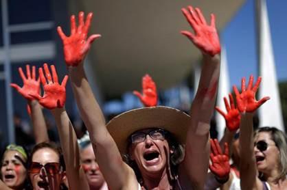Demonstrators attend a protest against rape and violence against women in Brasilia, Brazil, May 29, 2016.