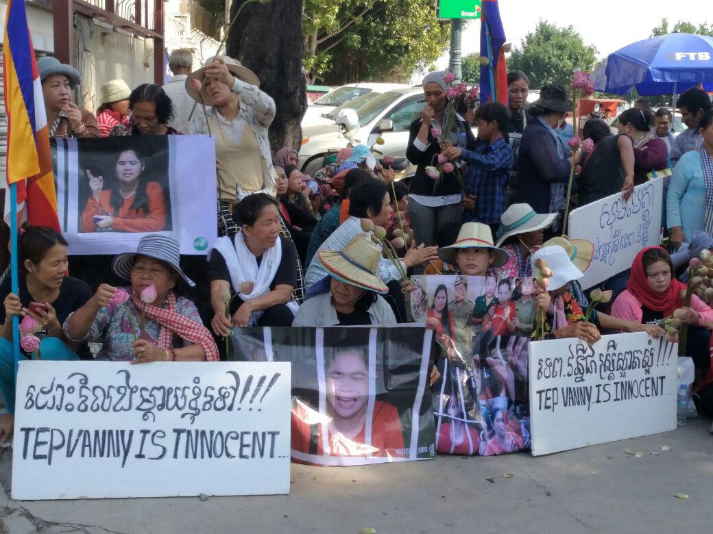 People gather outside the Appeals Court in Phnom Penh, Cambodia on August 8, 2017, holding signs of support for land rights activist, Tep Vanny. 