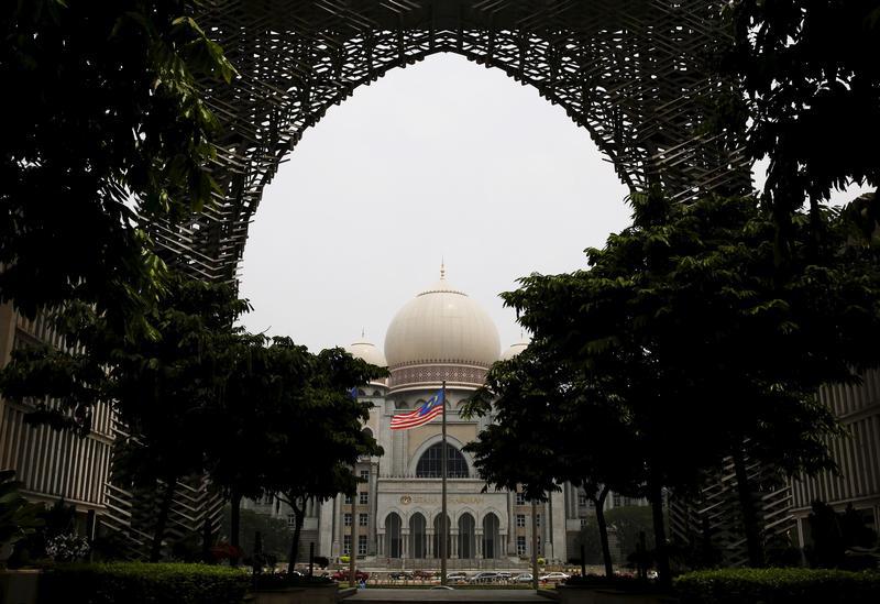 Malaysia's national flag flies in front of the Federal Court on a hazy day in Putrajaya, Malaysia, October 6, 2015.