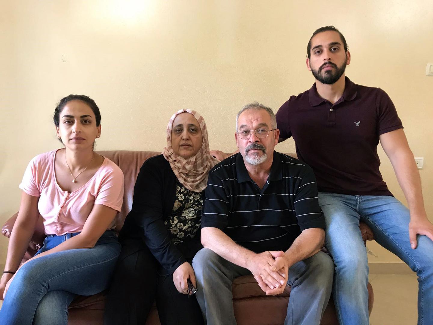 Wael Kawamleh, a Palestinian resident of East Jerusalem, with his wife, Faheema al-Saedi, and two eldest children, Fayez and Khulood. Israeli authorities rejected residency applications for Fayez and Khulood, leaving them effectively stateless and unable 