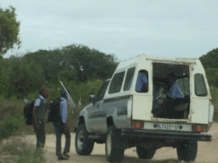 School children waiting to board their school transportation.