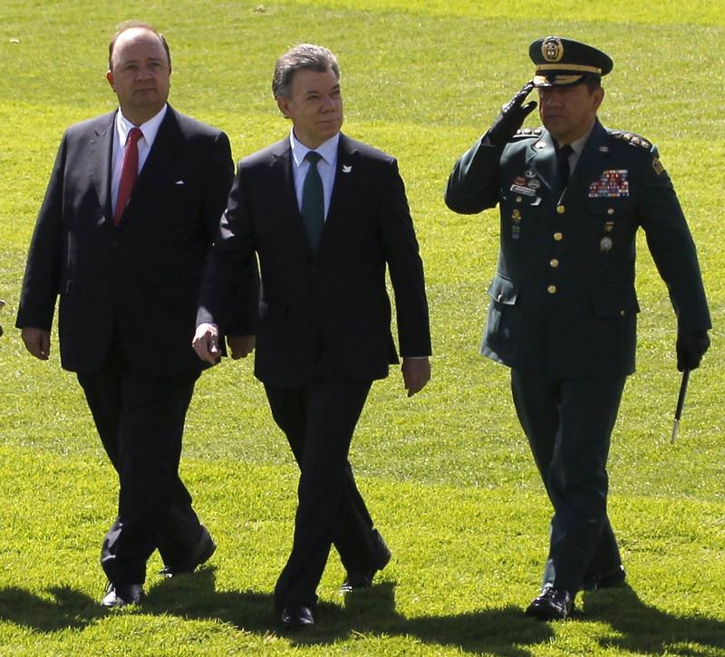 Colombia's President Juan Manuel Santos, Colombia's Defense Minister Luis Carlos Villegas and Colombian armed forces chief Gen. Juan Pablo Rodriguez