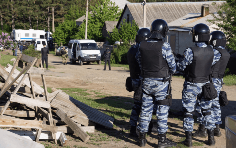 Law enforcement search the house of a Crimean Tatar activist in Stroganovka, Crimea, May 2017.