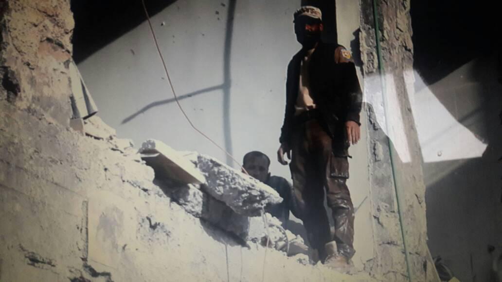 A member of the Syria Civil Defense and a survivor of the strike on the Atarib Police Station