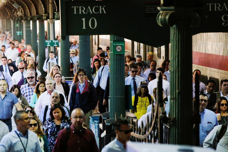 People arrive to commute to New York at the Hoboken Terminal in New Jersey, U.S. July 10, 2017.