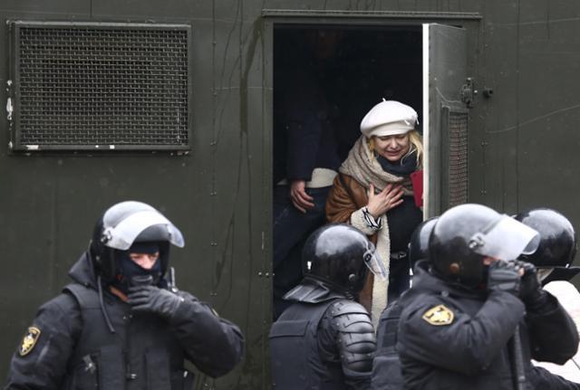 A woman detained during a protest on March 25 in Minsk. 