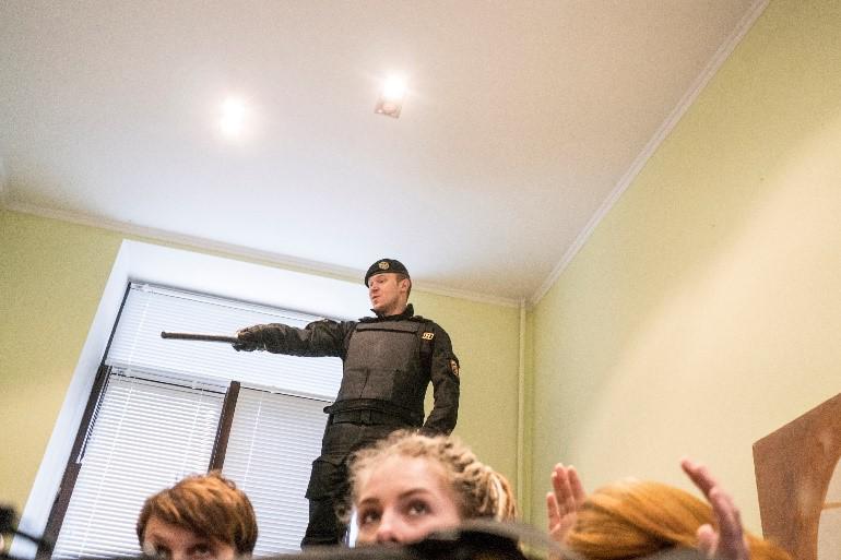 Police raid the Viasna Human Rights Center in Minsk on March 25. 