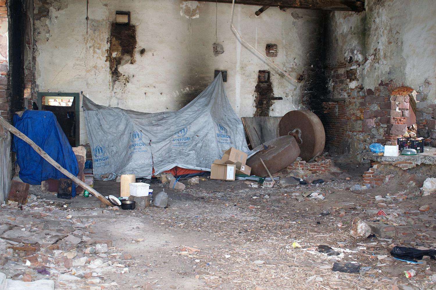 A makeshift shelter at a squat in an abandoned building, on Lesbos, where Syrian asylum seekers live. Since the EU-Turkey deal entered into foce, in March 2016, thousands of people have been trapped in abysmal conditions on the Greek islands. 