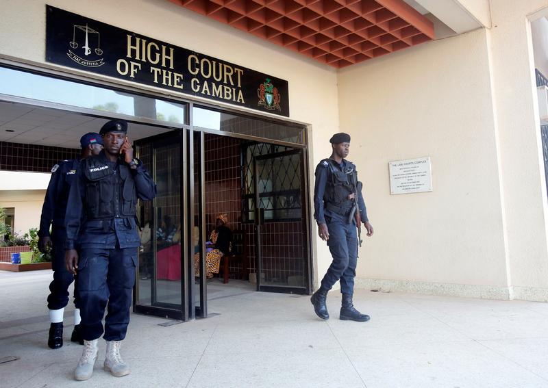 Security forces stand next to the entrance of the Gambian high court in Banjul on December 5, 2016.