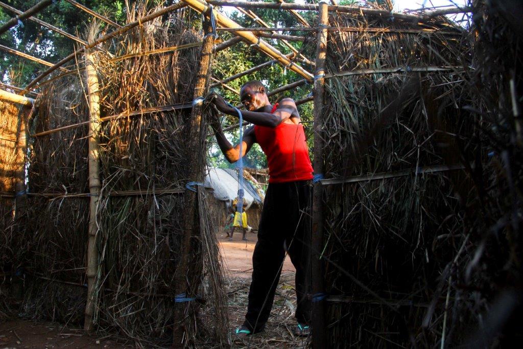 A newly displaced man builds a hut in Bambari, Central African Republic. Fighting between UPC and FPRC militia in Ouaka province has forced about 11,000 people to seek refuge in Bambari since February. 