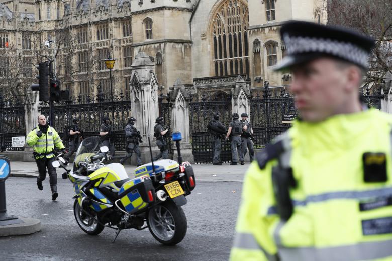 Armed police respond outside Parliament during an incident on Westminster Bridge.