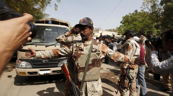 A Pakistan Ranger gestures to stop members of the media from taking pictures at an anti-terrorism court in Karachi, Pakistan on March 12, 2015.
