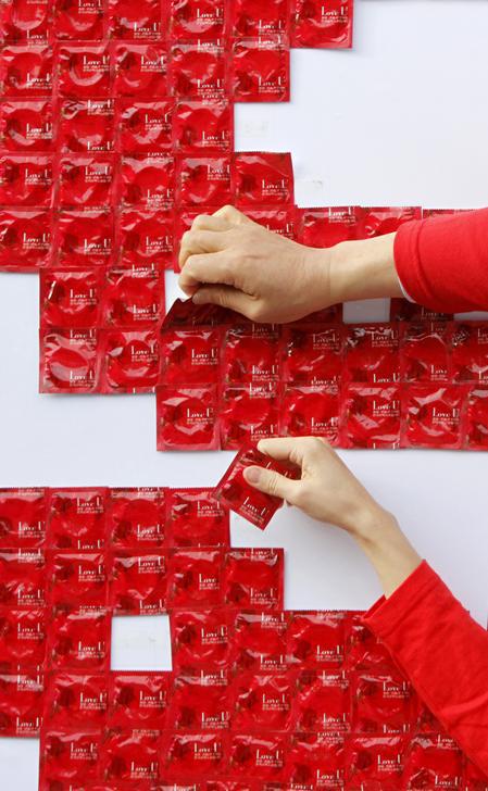 Participants work on a campaign for World AIDS Day in Seoul, South Korea, December 1, 2011.