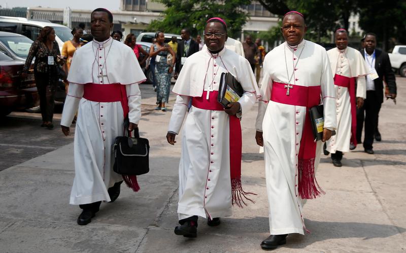 Congolese Catholic Church (CENCO) Bishops Fidele Nsielele (left), Marcel Utembi (center), and Fridolin Ambongo (right) arrive to mediate talks between the opposition and the government of President Joseph Kabila in the Democratic Republic of Congo's capit