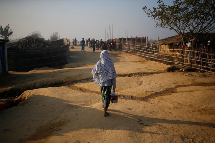 A Rohingya Muslim woman walks at the Kutupalong refugee camp in Cox’s Bazar, Bangladesh, on February 4, 2017. 