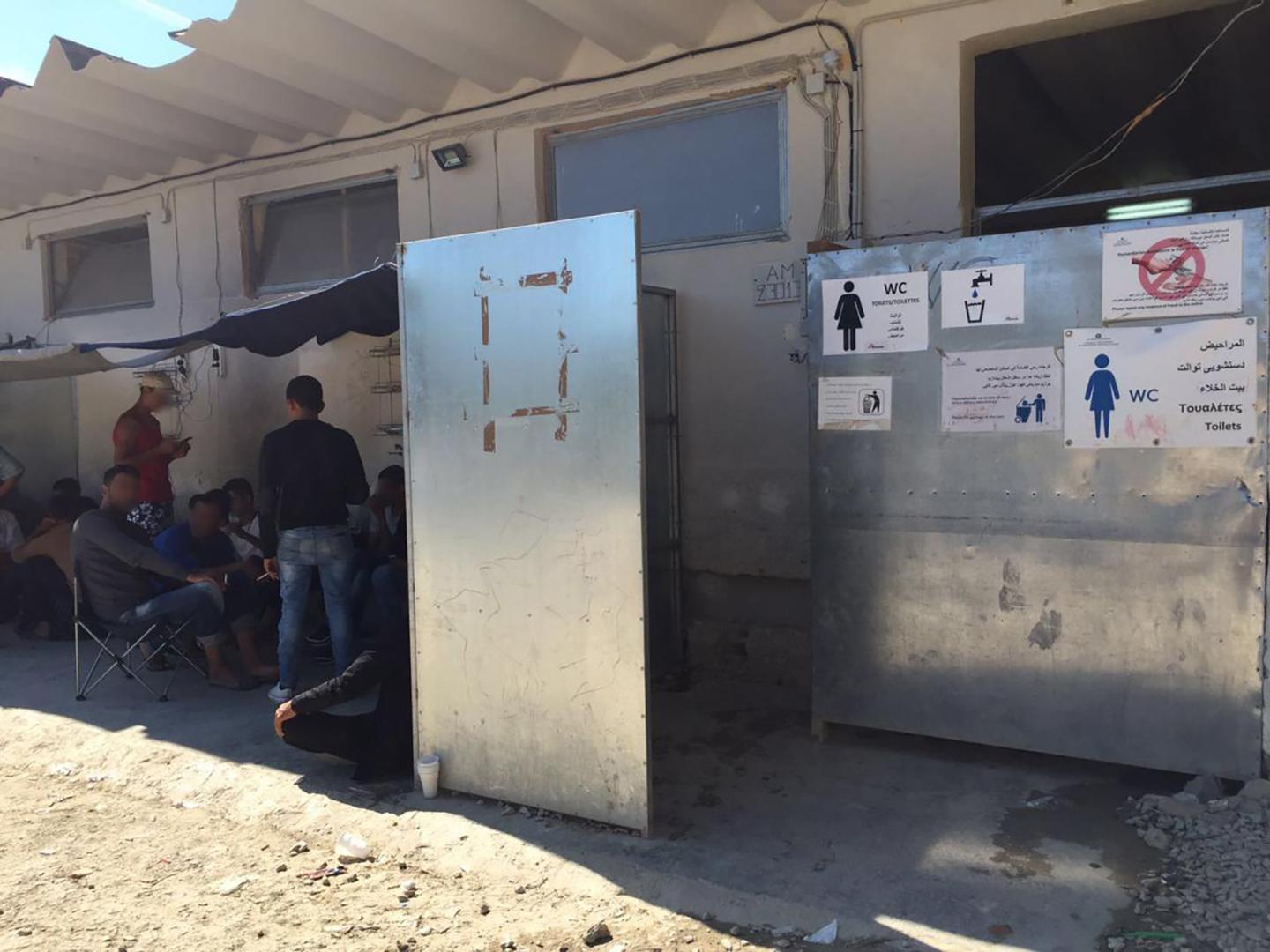 Men are regularly present near the women’s latrine at the Moria refugee camp, on Lesbos Island, Greece. Women described routine sexual harassment, particularly when going to and from or using the camp’s bathrooms. 