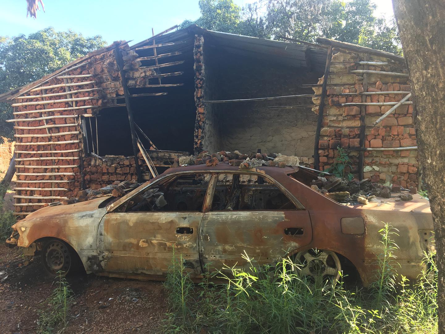 The burned house and car of Pinto, a Renamo member in Gorongosa village. Neighbors said they saw soldiers set the house and car on fire on February 17, 2016. 