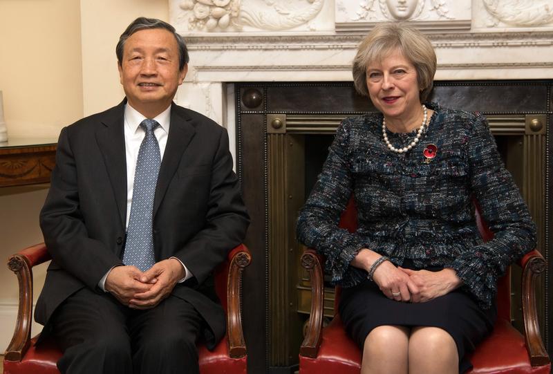 Britain's Prime Minister Theresa May (R) greets China's Vice Premier, Ma Kai, as he arrives in 10 Downing Street, in London November 9, 2016 in London.