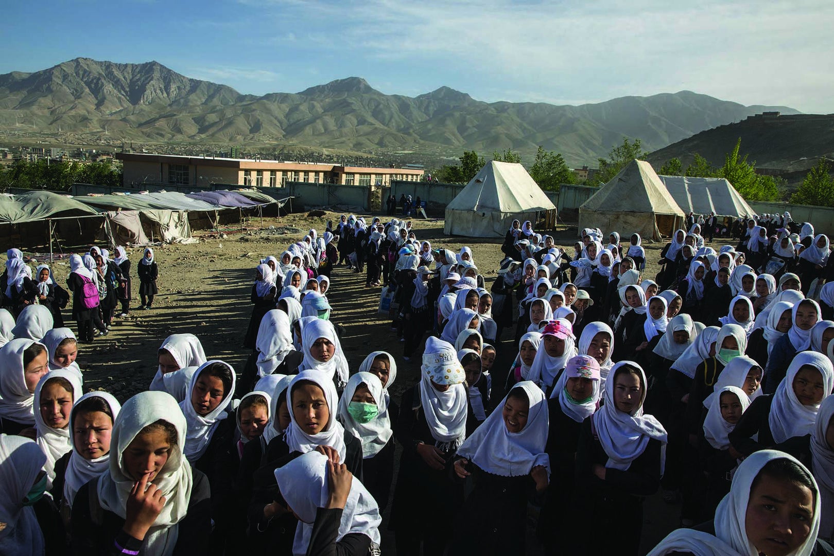 Girls gather to go home from school.
