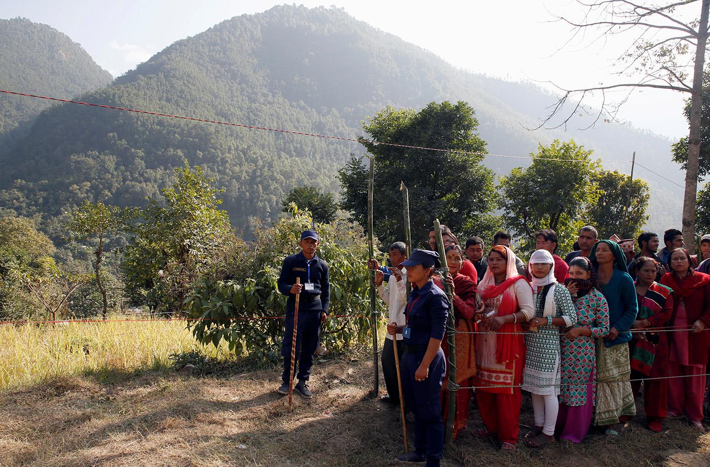 Villagers wait to vote at a polling station during the parliamentary and provincial elections in Sindhupalchok district, Nepal, November 26, 2017.