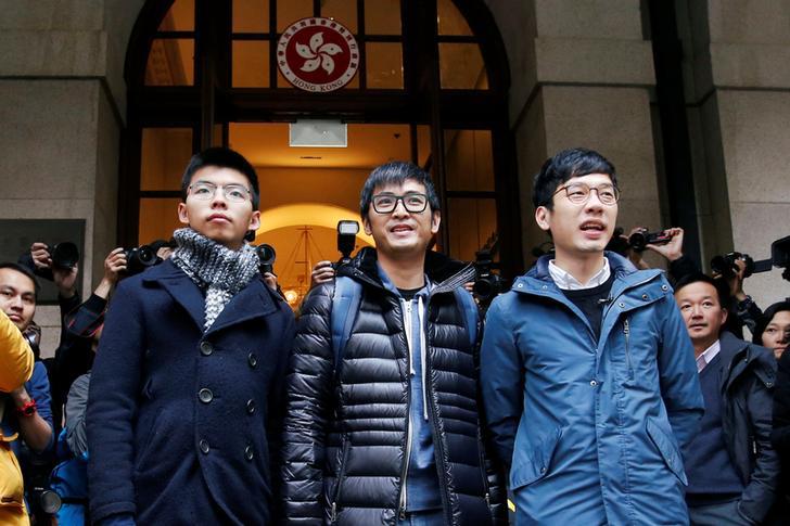 Pro-democracy activists Joshua Wong, Alex Chow and Nathan Law outside the Court of Final Appeal before a verdict on their appeal in Hong Kong, February 6, 2018.