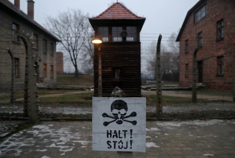 A sign reading "Stop!" in German and Polish is seen at the former Nazi German concentration and extermination camp Auschwitz, during the ceremonies marking the 73rd anniversary of the liberation of the camp and International Holocaust Victims Remembrance 