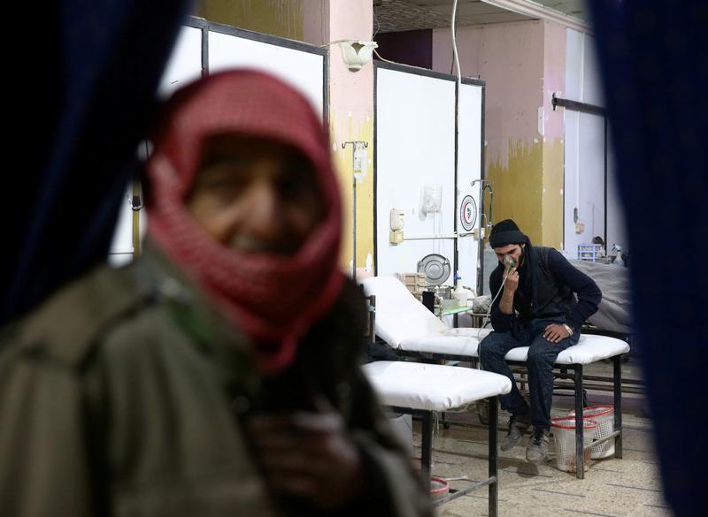 A man breathes through an oxygen mask at a medical center in Douma, Eastern Ghouta in Damascus, Syria January 22, 2018. 