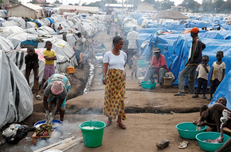 A woman walks at an internally displaced persons (IDP) camp in Bunia, Ituri province, eastern Democratic Republic of Congo, April 12, 2018. 