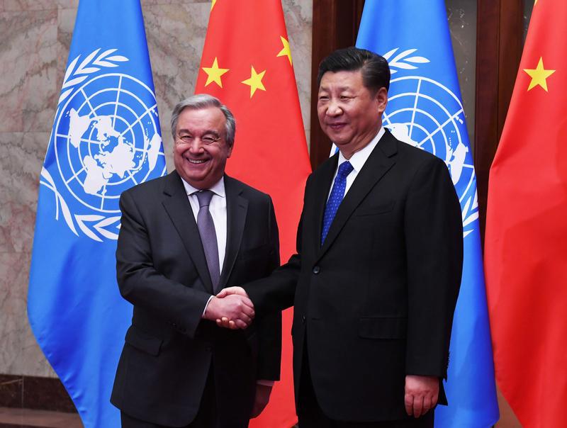 U.N. Secretary-General Antonio Guterres shakes hands with Chinese President Xi Jinping at the Great Hall of the People in Beijing, China, April 8, 2018.