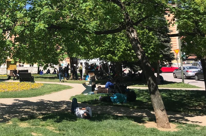 Asylum seekers and other migrants gather in a park in Bosnia and Herzegovina’s capital Sarajevo, where volunteers provide them with food, blankets, and medical care. 