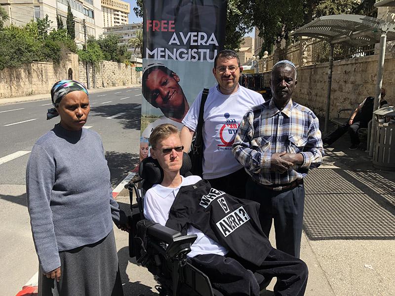 Avera Mangistu’s parents and disability rights activists at a protest tent in Jerusalem.