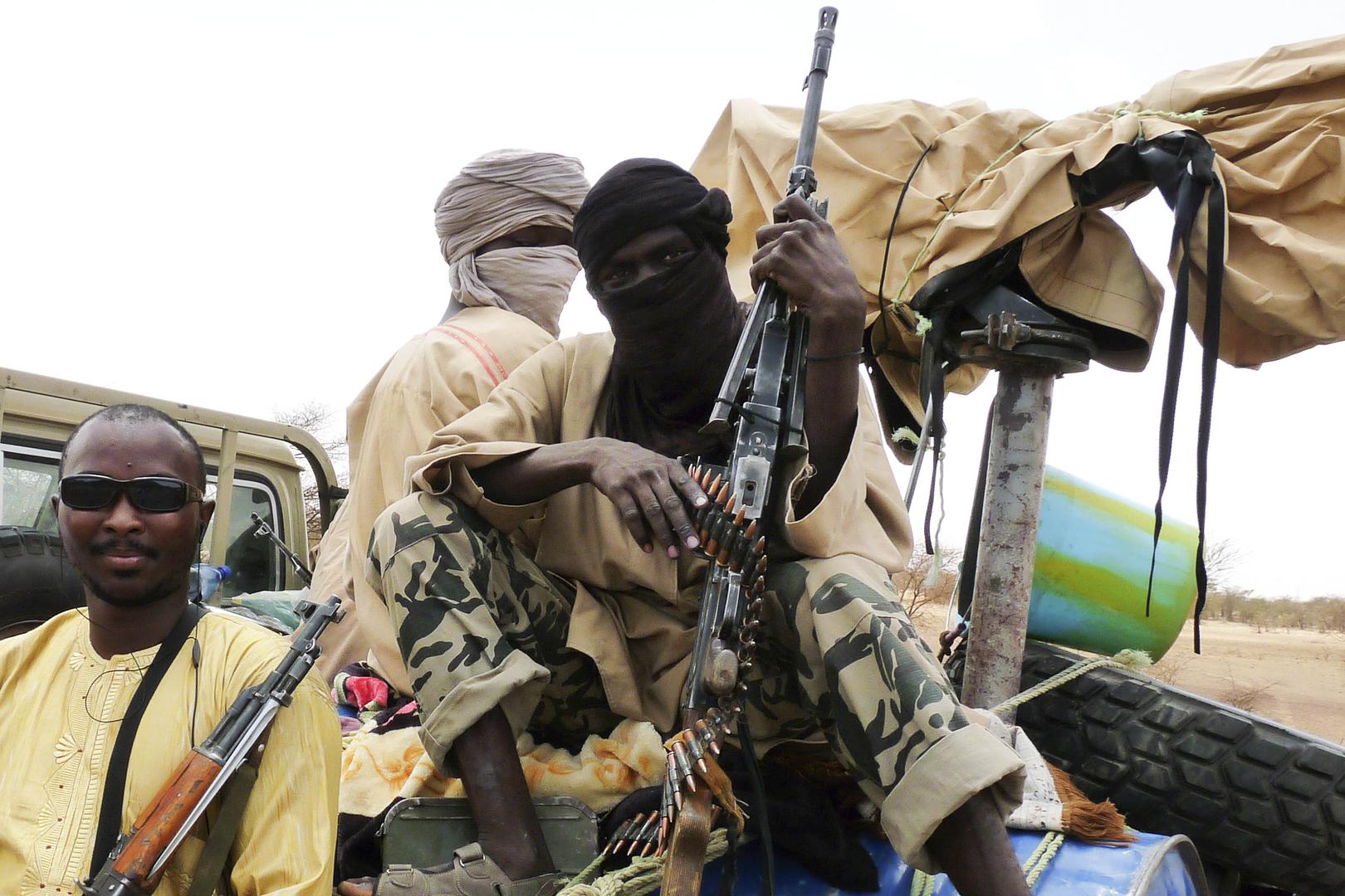 Combatants from Al-Qaeda-affiliated Islamist group Ansar Dine sit in a vehicle in Gao in northeastern Mali.