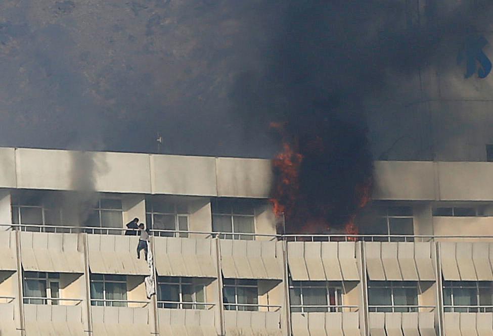 A man tries to escape from a balcony during the attack at Kabul’s Intercontinental Hotel, January 21, 2018.