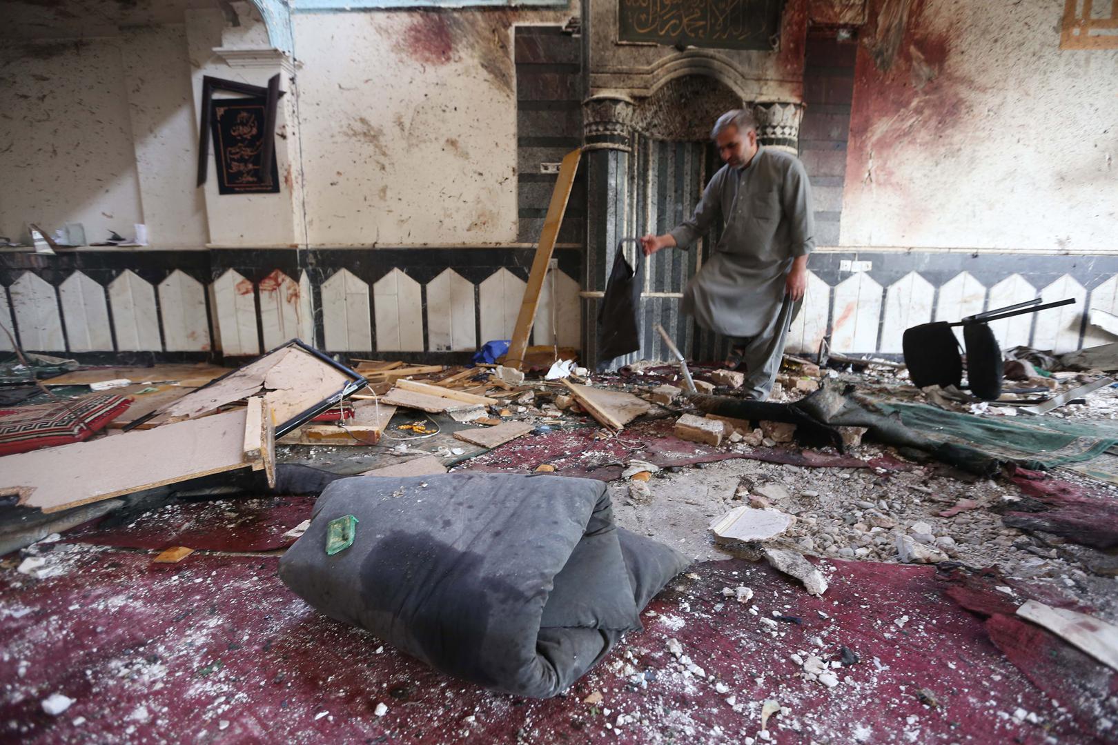 A man surveys the destruction a day after the suicide bomb attack at the Jawadiya Mosque in Herat, August 2, 2017.