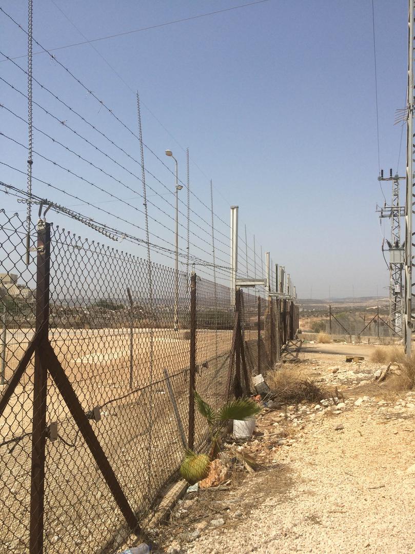 Agricultural gate in Mas-ha for Palestinian farmers bearing permits to access their land on the other side of the separation barrier at designated times. 