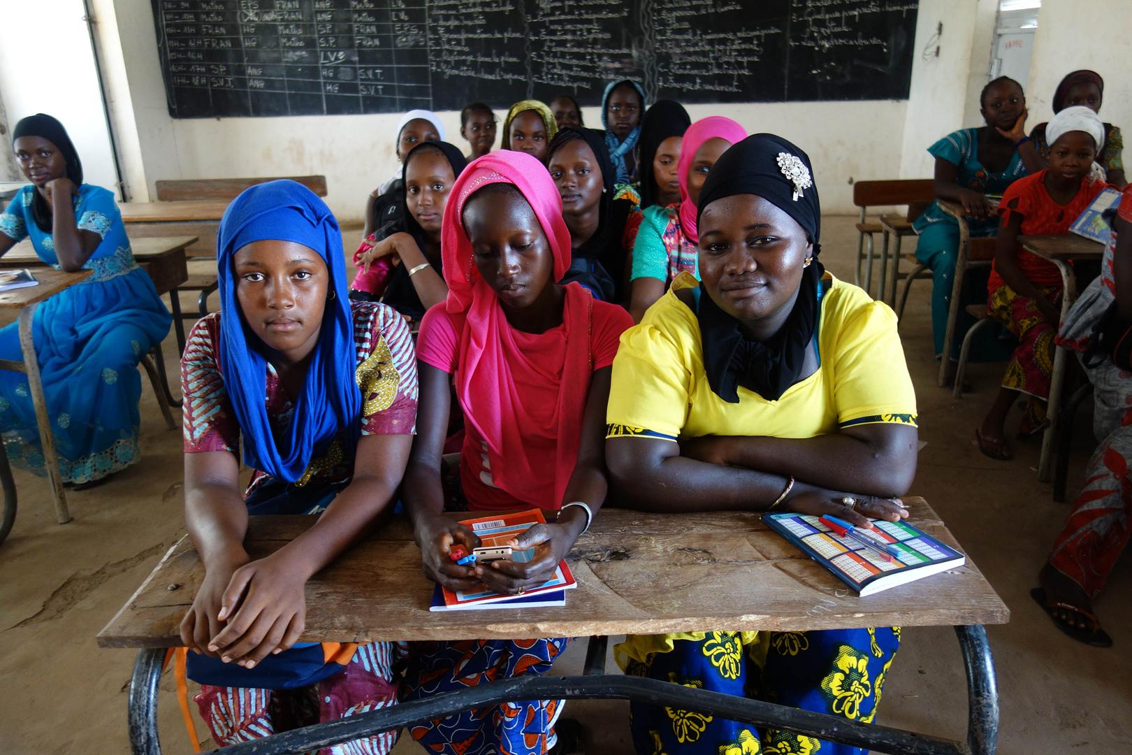 Students enrolled in the final year of lower secondary school in the classroom in a village in Kolda region, southern Senegal. Adolescent mothers and married girls study in this school. 