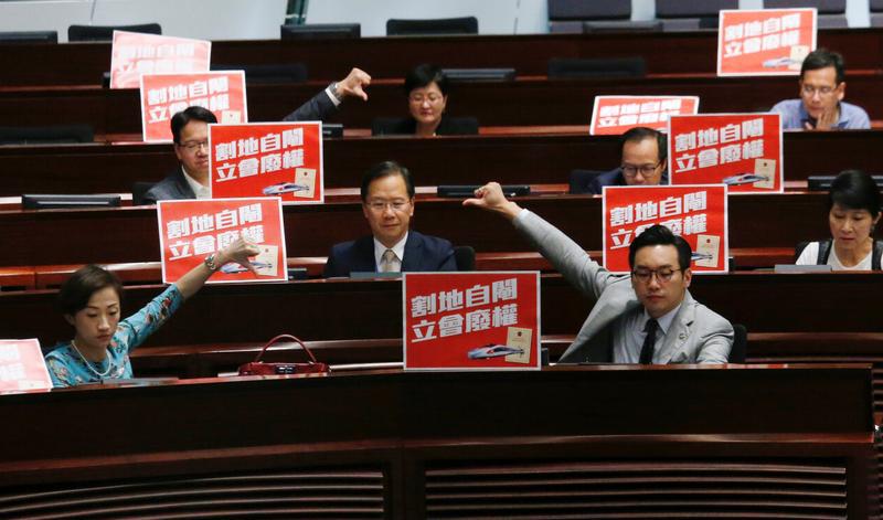 Pro-democracy lawmakers react after Legislative Council passed a controversial bill to introduce mainland Chinese laws inside an upcoming high-speed rail station, in Hong Kong, China June 14, 2018.
