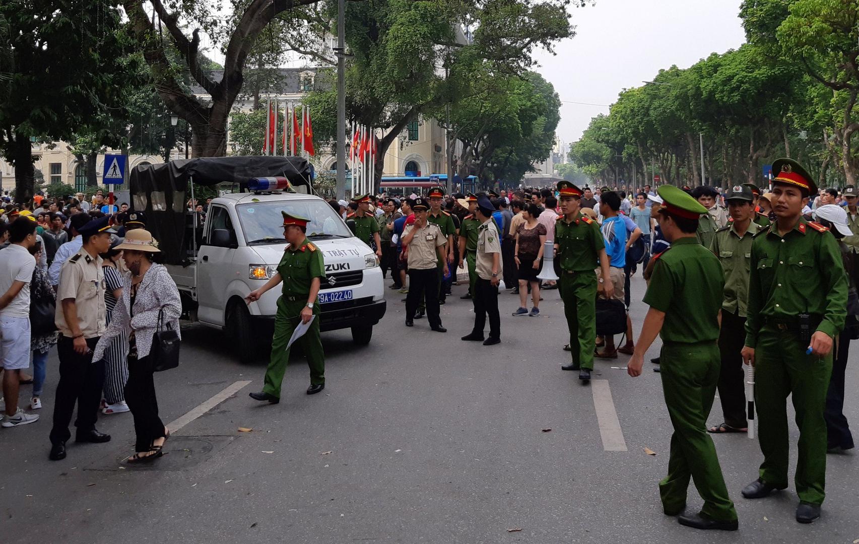 Police disperse a demonstration against a draft law on special economic zones in Hanoi, Vietnam, June 10, 2018. 
