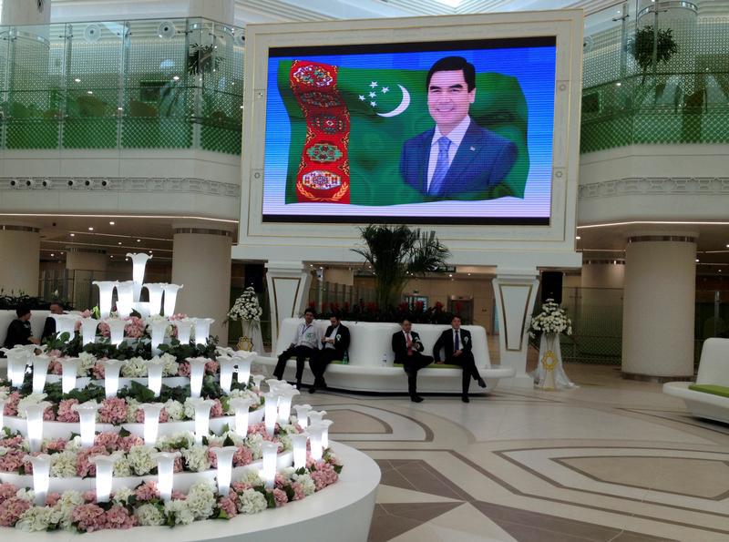 A screen showing a portrait of Turkmen President Kurbanguly Berdymukhamedov inside the terminal of the newly built airport in Ashgabat