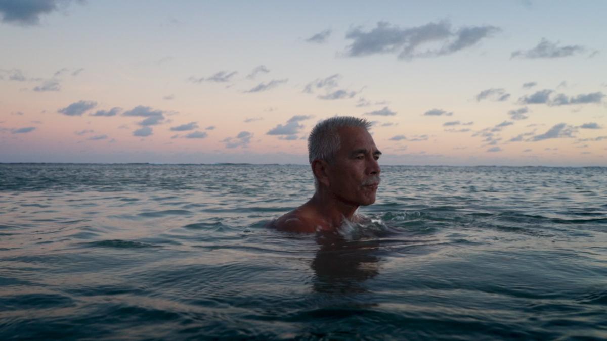 Anote Tong, then president of Kiribati, swims in the lagoon near his home.