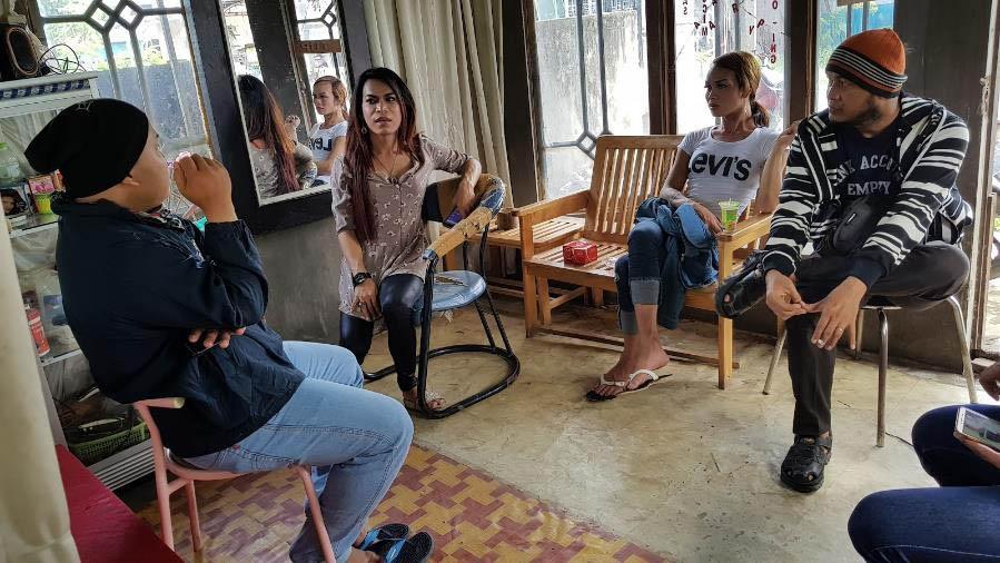 Transgender activists in Amuntai, South Kalimantan, discuss the increase in discrimination they face while distributing condoms. Photo by Andreas Harsono.
