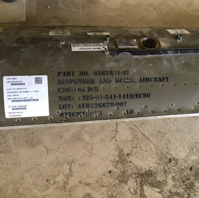 The casing from a CBU-105 Sensor Fuzed Weapon used in the attack near the quarry of the Amran Cement Factory on February 15, 2016, found by factory staff on the road up to the quarry.