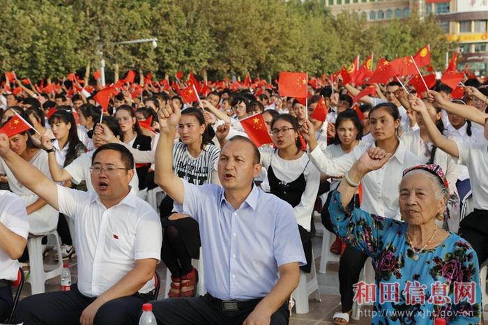 People denounce the “three evil forces” in a mass political meeting in Hotan, Xinjiang. 