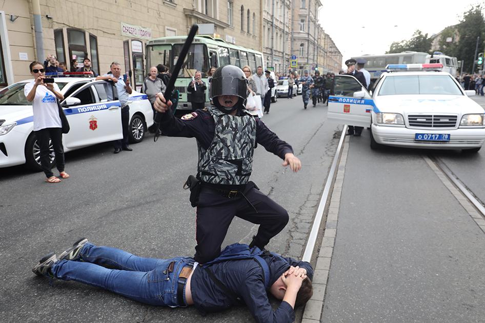 Police detain a protester in St. Petersburg, Russia.