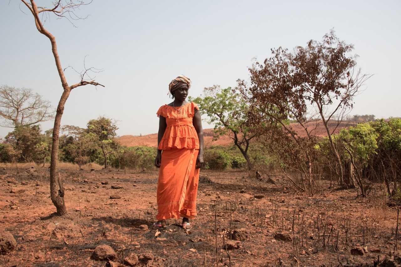 A woman in Lansanayah, a village 750 meters from a bauxite mine owned by La Société Minière de Boké consortium.