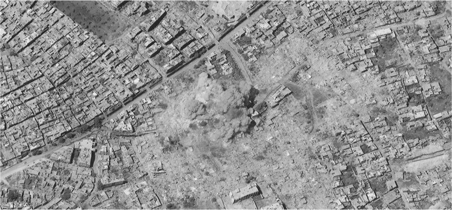 Satellite image of a large blast cloud from the demolition of a residential apartment building with high explosives. Blast cloud consistent with the detonation of a large conventional bomb