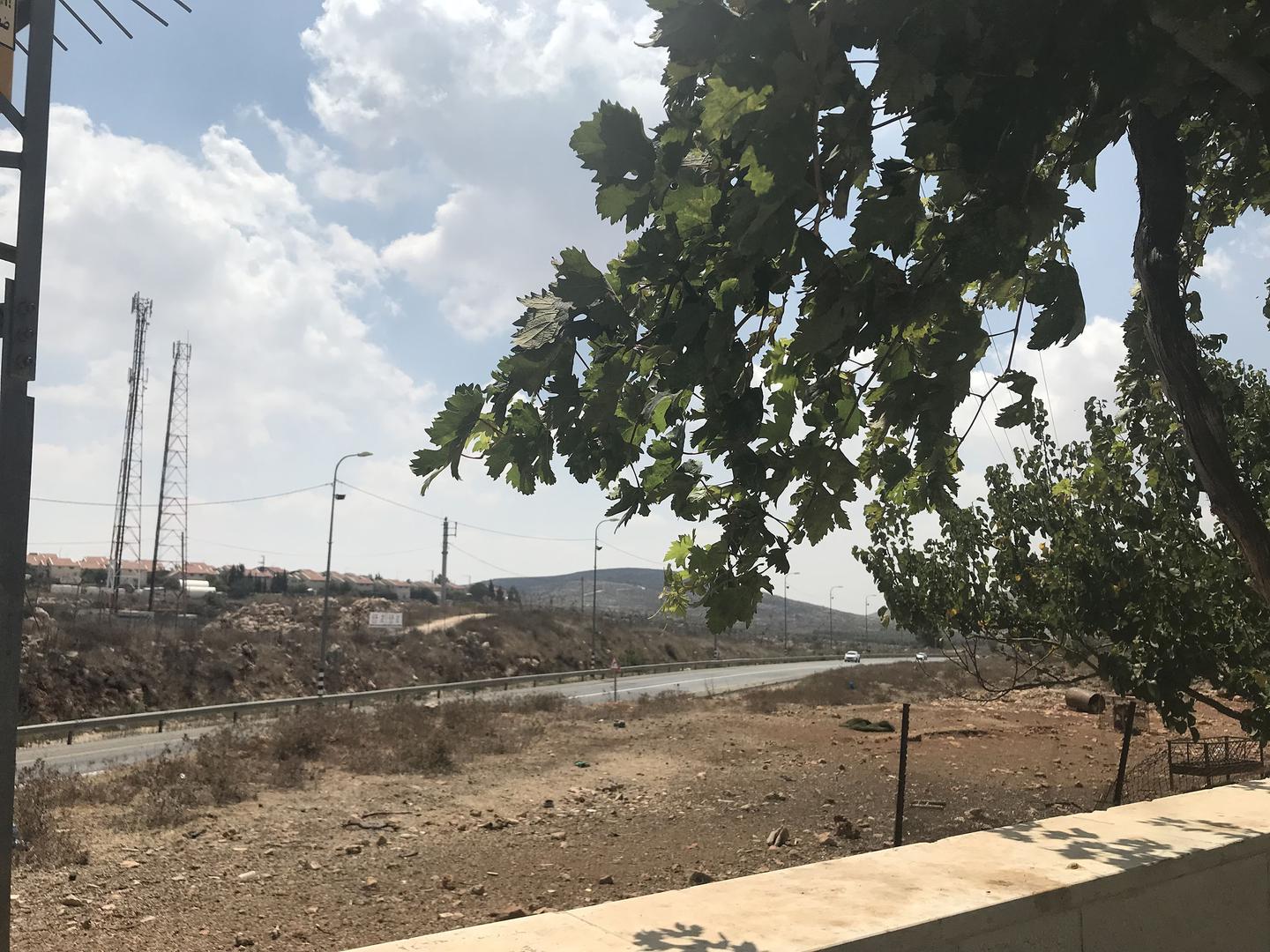 View of the Israeli settlement of Ofra and Road 60, an Israeli highway that runs largely through the center of the occupied of the West Bank, from Ein Yabroud, a Palestinian village northeast of Ramallah. Israeli authorities built parts of Road 60 and Ofr