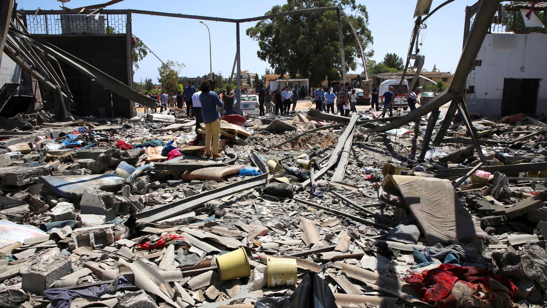 Debris covers the ground after an airstrike on the Tajoura migrant detention center in Tajoura east of Tripoli in Libya where 53 migrants were killed, Wednesday, July 3, 2019. 